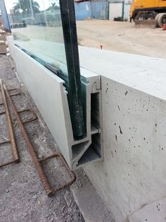 an open window on the side of a building with construction equipment in the foreground