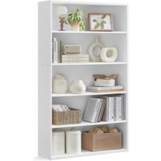 a white book shelf filled with lots of books and knick - knacks