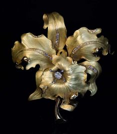 For Sale on 1stDibs - Circa 1910 This very large antique matte and polished green 18K gold brooch is superbly modeled as a stylized orchid embellished with numerous old rose Luxury Brooches With Rose Cut Diamonds, Luxury Gold Brooches With Rose Cut Diamonds, Elegant Diamond Flower Brooch, Elegant Gold Brooches With Rose Cut Diamonds, Elegant Diamond Flower Brooches, Luxury Wedding Brooches With Single Cut Diamonds, Luxury Wedding Brooch With Single Cut Diamonds, Luxury Single Cut Diamond Brooch For Wedding, Luxury Single Cut Diamond Wedding Brooches