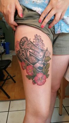 a woman with a tattoo on her thigh