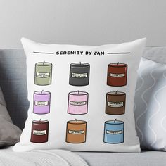 a throw pillow with different types of candles on the front and back of it,