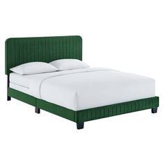 a bed with green headboard and white sheets