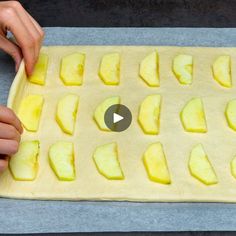 someone is making an apple tart on a baking sheet