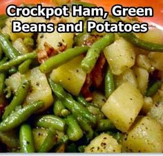 green beans and potatoes on a plate with the words crockpot ham, green beans and potatoes