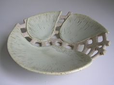 a white bowl sitting on top of a table