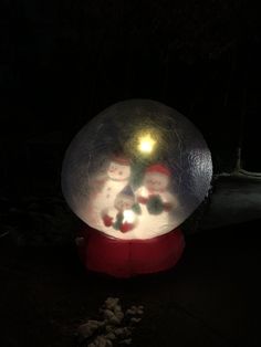 there is a snow globe with lights on it