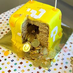 a birthday cake with coins in the middle