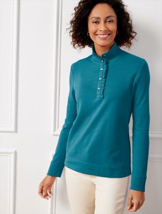 The must-have pullover elevated with pretty ruffles at the buttoned half-placket. Crafted with cozy rib knit trim at the mockneck and sleeve cuffs. A sophisticated finish to any outfit. Features Pullover Long Sleeve Hits At Hip Mockneck Straight hem Imported Fit: Misses: 24"; Petite: 23; Plus: 26"; Plus Petite: 24 1/2" Material: 100% Cotton Care: Turn Garment Inside Out, Machine Wash Cold, Gentle Cycle, Only Non-Chlorine Bleach When Needed; Tumble Dry Low, Warm Iron If Needed | Ruffle Placket Mockneck Pullover Sweater Talbots Classic Style Women, Modern Classic, Pullover Sweater, Mock Neck, Pullover Sweaters, Sweater Outfits, Rib Knit, Ruffles, Inside Out