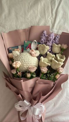 a bouquet of flowers with stuffed animals in it