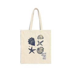 a tote bag with seashells and starfish printed on the front in blue ink