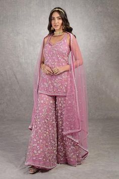 Mauve orchid silk organza kurta with floral embroidered motifs. Paired with gharara and dupatta.
Component: 3
Pattern: Embroidered
Type Of Work: Floral
Neckline: Sweetheart
Sleeve Type: Sleeveless
Fabric: Kurta, gharara- Silk organza, Dupatta- Tulle
Color: Purple
Other Details: 
Silver bead and sequin borders
Velvet border hem
Sheer dupatta
Occasion: Sangeet - Aza Fashions Kurta And Sharara Set, Organza Kurta, Kurta And Sharara, Sheer Dupatta, Embroidered Motifs, White Kurta, Floral Peplum, Party Wear Indian Dresses, Sharara Set