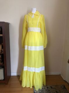 "Seventies vintage  Overlay fabric is sheer Sleeves are not lined A line skirt  Lemon yellow with lace accents  Collar Zipper closure Fabric is in great condition no stains  Zipper in working order Measurements  Shoulders 15.5\" Pit to pit 17\" Waist 14\" Hips 24\" Length from shoulder 57\" If you have any questions please ask" Vintage Overlay, Long Sleeved Dress, Sleeved Dress, Line Skirt, Dress With Lace, Lemon Yellow, Sheer Sleeves, Dress Clothes For Women, A Line Skirt