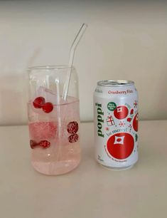 two glasses filled with liquid next to each other on top of a white countertop