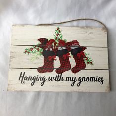 a wooden sign that says hanging with my gnomes