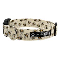 a dog collar with bees on it and the words oh my paw written in black