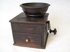 an old wooden box with a bowl on top