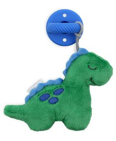 a green stuffed toy with a blue tag hanging from it's side