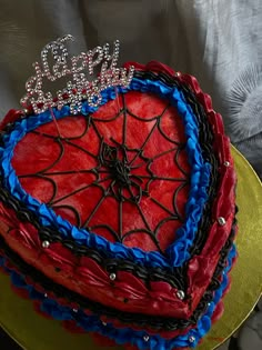 a red, white and blue cake with a spiderman on it