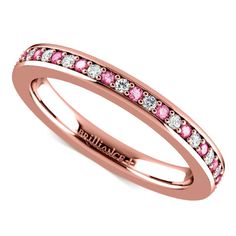 a rose gold ring with pink and white diamonds