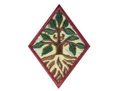 an embroidered patch with a tree and leaves on the front, in red and green