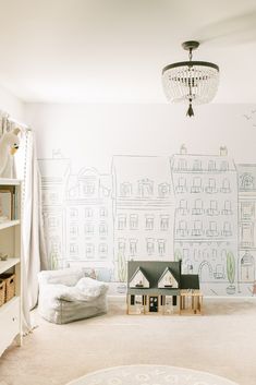 a child's room with a wallpapered cityscape