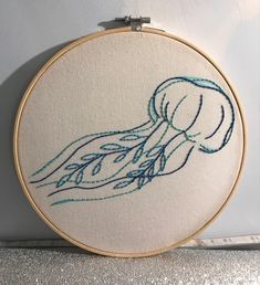 an embroidery project with a jellyfish on it