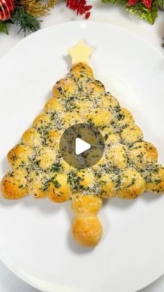 a white plate topped with food and a christmas tree decoration on top of the plate