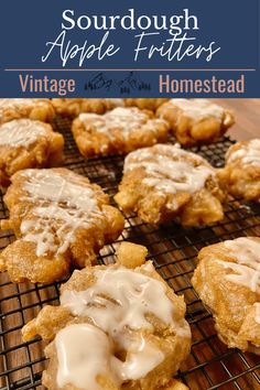 homemade sugar doughnut apple fritters are cooling on a wire rack with icing