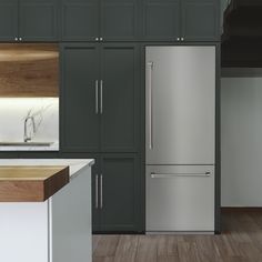 a large stainless steel refrigerator in a kitchen