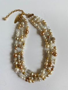 Classic and timeless Cream Multi-strand Pearl Necklaces, Cream Pearl Multi-strand Necklace, Cream Multi-strand Pearl Necklace, Elegant Multi-strand Beige Necklace, Elegant Beige Multi-strand Necklace, Elegant Multi-strand Cream Beaded Necklaces, Pearl White Multi-strand Beaded Necklace, Elegant Cream Multi-strand Beaded Necklaces, Elegant Cream Multi-strand Beaded Necklace