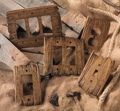 several pieces of wood sitting in the sand