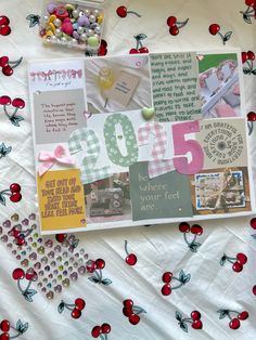 a table topped with lots of different items and paper on top of a white sheet