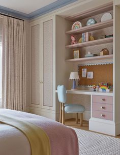 a child's bedroom with pink and white furniture, blue trimming on the walls