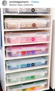 a white refrigerator freezer sitting next to a shelf filled with lots of plastic containers