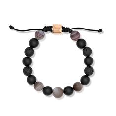 This stylish bracelet is hand strung with Botswana agate, matte black agate, black lava stone, and brown moonstone beads that range in size from 10-12mm. The 14 karat rose gold push down clasp is engraved with the Stephen Silver Fine Jewelry logo and makes the bracelet adjustable in size. Reference Code: 33455 Shop other beautiful pieces in our Bracelet Collection. For inquiries on the piece please contact boutique@shsilver.com Luxury Adjustable Bracelets With Black Beads, Elegant Lava Stone Bracelets With Round Beads, Elegant Lava Stone Beaded Bracelets, Elegant Lava Stone Bracelet With Round Beads, Elegant Adjustable Lava Stone Jewelry, Elegant Black Lava Stone Beaded Bracelets, Stephen Silver, Jewelry Logo, Botswana Agate