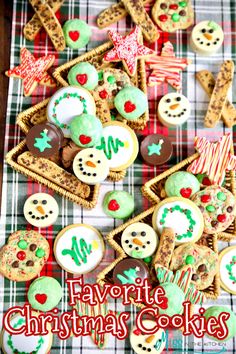 christmas cookies are arranged on a plaid tablecloth