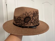 Hand painted/ hand drawn design on felt wide brim fedora. One size fits most- adjustment strings inside rim of hat. Great for floral lovers of all kinds.  Please message with any questions prior to purchasing! Happy shopping! Burn Hats, Burning Hats, Decorated Hats, Burned Hats, Dandelion Paperweight, Hat Painting, Blooming Sunflower, Hat Decor, Western Vibes