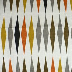 an orange, grey and white pattern on fabric