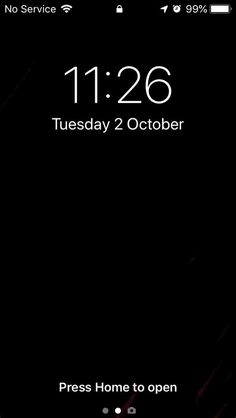 an iphone screen showing the time on it's display, and its home button