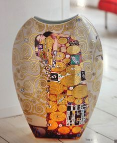 a vase with an image of a woman's face painted on the front and sides