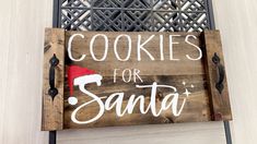 a wooden sign that says cookies for santa