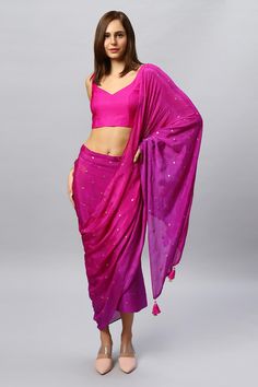 Step into sophistication with our elegant Jolie Magenta Ombre Sarong Saree with a tasseled shoulder drape! This lightweight marvel drapes effortlessly, offering comfort across all seasons. Explore a spectrum of vibrant colors, each embodying its unique charm. Perfect for any occasion, it redefines elegance with its simplicity, making it a must-have for those who appreciate refined style with a touch of tradition. The blouse is optional and sold separately. This sarong saree can be worn with any Bollywood Blouse Piece With Tassels In Traditional Drape, Bollywood Blouse Piece With Traditional Drape And Tassels, Draped Dupatta For Festivals, Diwali Pre-draped Saree With Tassels, Traditional Drape Blouse Piece With Tassels, Bollywood Style Blouse Piece With Tassels, Party Saree With Tassels, Festive Blouse Piece With Tassels, Bollywood Saree With Tassels For Navratri