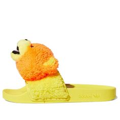 Looking for a summer-ready sandal that will make everyone smile? Check out the Jeremy Scott x adidas Adilette Slide ‘JS Bear’! This fun and playful take on the classic slip-on sandal features a fuzzy teddy bear head on the strap upper, along with a contoured footbed and color-matched synthetic outsole. Adidas Synthetic Slip-on Slides, Comfortable Adidas Slip-on Slides, Adidas Synthetic Slides With Rubber Sole, Adidas Non-slip Summer Slides, Adidas Slides With Rubber Sole, Adidas Slip-on Slides, Adidas Casual Sport Sandals For Summer, Adidas Casual Slides For Spring, Adidas Synthetic Slide Flip Flops