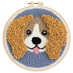 a dog's face is shown on the front of a cross - stitch hoop