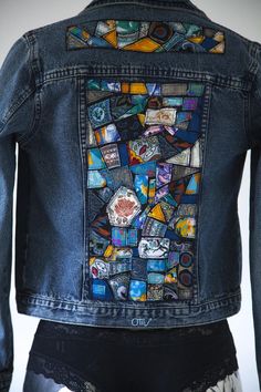 a jean jacket with patches on the back