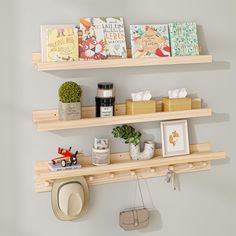 two wooden shelves with books and toys on them