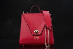 Red Leather Handbag Top Handle, Women's Leather Sophisticated high quality cow hide leather, this red saffiano leather handbag is 100 % handmade and hand stitched, created perfectly for the modern elegant woman. It s size it s 25 cm wide, 23 cm height and 11 cm width. The measurements are taken at the base of the bag. It has a fix strap of 118 cm long but we can make it custom to your preferred size if requested. The bottom of the bag is protected with metal legs. It has 1 pocket inside and a sa Red Leather Handbags, Leather Bag Women, Elegant Woman, Handmade Shop, Punk Rock, Leather Handbag, Cow Leather, Cowhide Leather, Hand Stitching