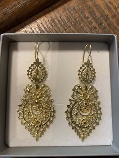 If you are looking for a different and unique earrings with history this is it. Details:     Material: 19,2k gold  Length: 6cm  + 1cm (the hook), total of 7cm Weight: 15,2 gr  SHIPPING: If either this is a gift for yourself or someone else, this item will be carefully packed in a proper gift package so that not only the item but also the package impresses whoever is opening it. The item will be dispatched with a tracking number that will provided to you. All items are stamped by the Portuguese a Traditional 14k Gold Drop Earrings, Ornate 14k Gold Earrings, Antique 22k Yellow Gold Earrings, Antique Gold Earrings For Festivals, Ornate Ceremonial Drop Earrings, Ceremonial Yellow Gold Drop Earrings, Elegant Gold Plug Earrings In Brass, Victorian Gold Earrings For Formal Occasions, Formal Yellow Gold Chandelier Earrings With Intricate Design