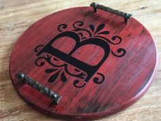 a wooden plaque with a lock on it and a heart in the middle, sitting on top of a table