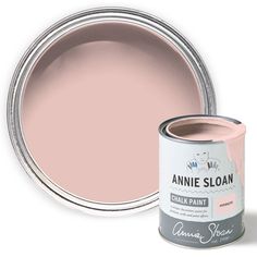 the pink paint is next to an open can of annie sloan's chalk paste